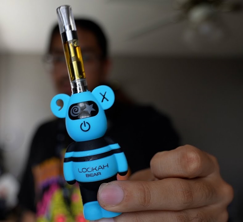 Lookah bear 510 vape battery in blue with 510 oil cart attached
