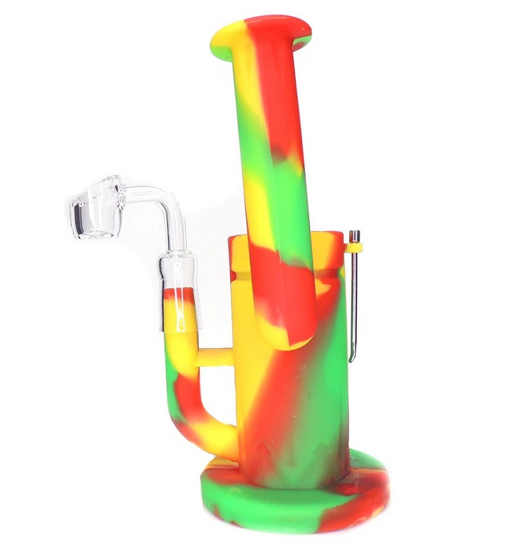 A red green and yellow silicon dab rig with glass banger