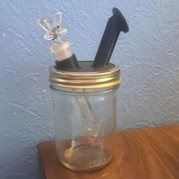 A mason jar adapted to be a bong