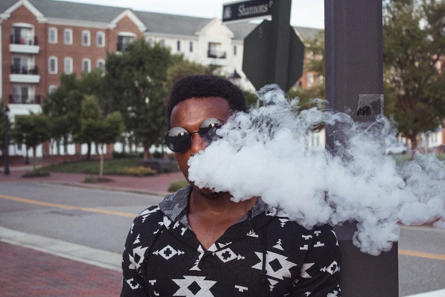 a man smoking a vape