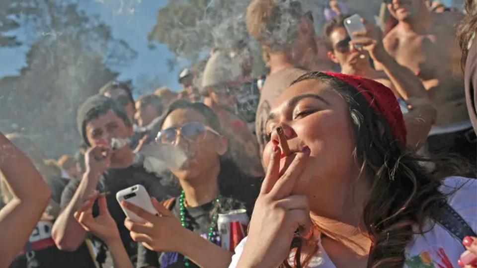 A group of people smoking marijuana